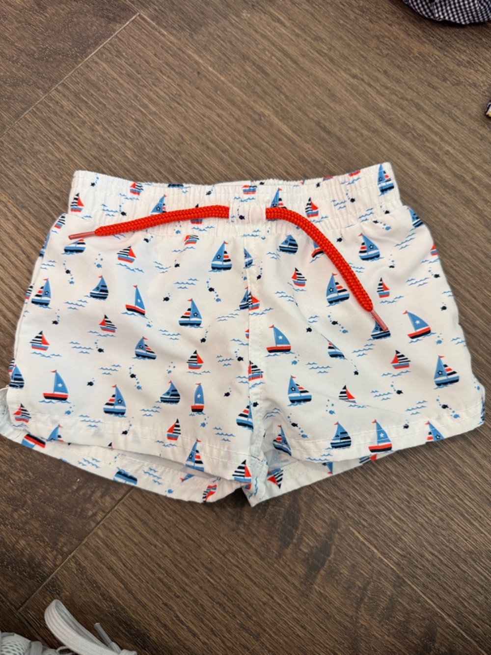 Starting Out White Swim Trunks with Red and Blue Sailboats